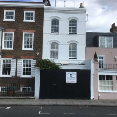 office building exterior painted in white for refurbishment project