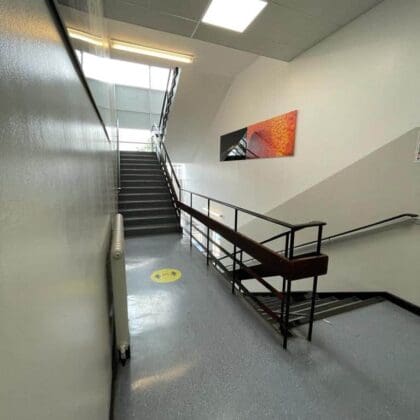 school refurbishment contractors painted secondary school hallway in two toned colour palette