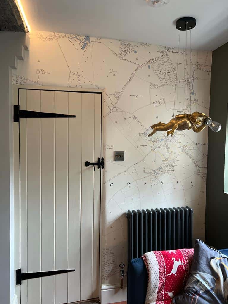 historical property in guildford with freshly painted internal door and rustic map wallpaper
