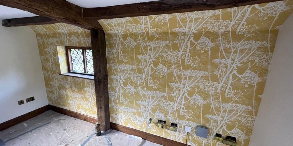 period home interior with freshly installed nature inspired yellow wallpaper