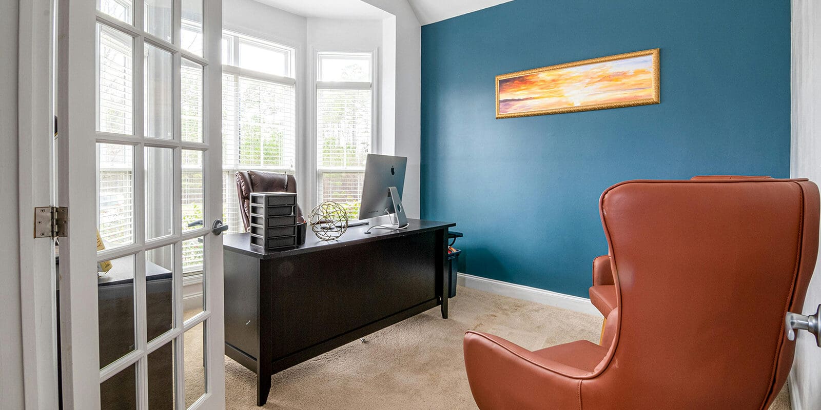 blue accent wall in home office renovated by decorators