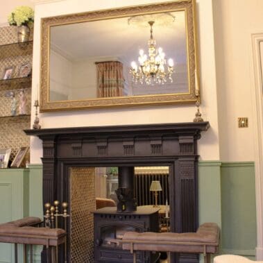 wall panelling and interior painting around fireplace restoration in Surrey