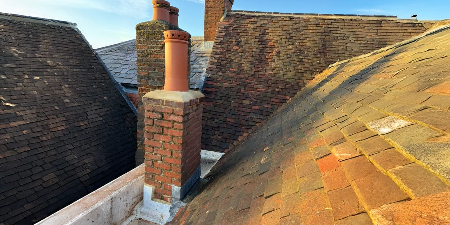 view from the roof showing exterior house maintenance work and roof repairs in progress