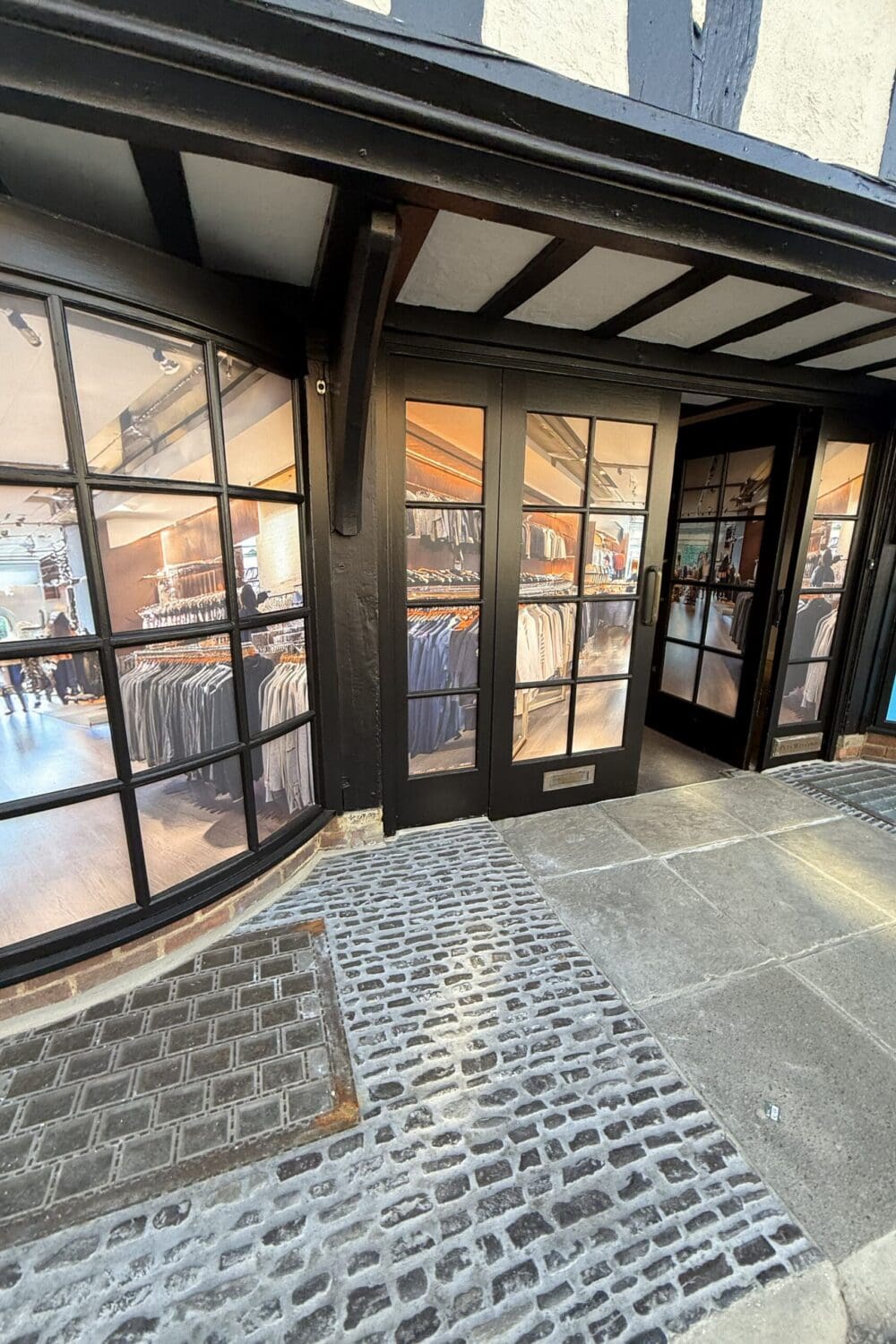 Masonry walls around door applied with lime render and mineral paint finish