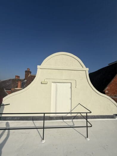 Roof door painted on commercial property exterior