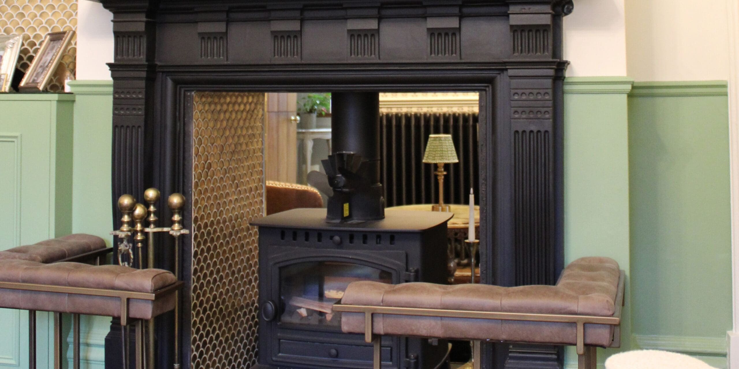 fireplace restoration with dark mantle and wall panelled walls