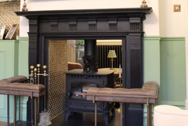 fireplace restoration with dark mantle and wall panelled walls