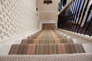 wallpaper in hallway and staircase in surrey home